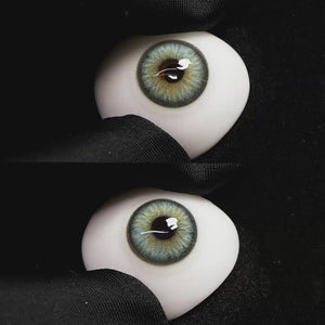 Diamond Green II contact lenses on a brown simulated eyeball with a black background