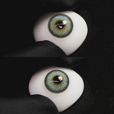 Diamond Green II contact lenses on a brown simulated eyeball with a black background