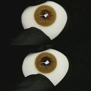 A simulated brown prosthetic eye showing the visual transformation effect of wearing Latte Brown colored contact lenses against a black background.