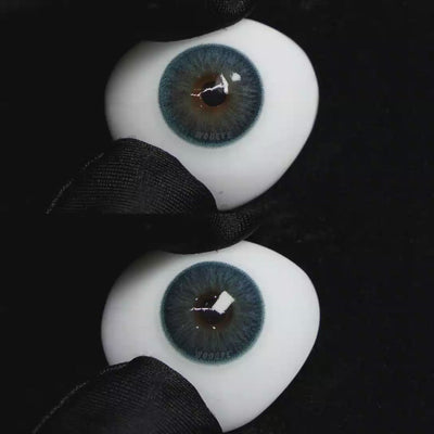 A simulated brown prosthetic eye showing the visual transformation effect of wearing Wooeye Elf Blue colored contact lenses against a black background.
