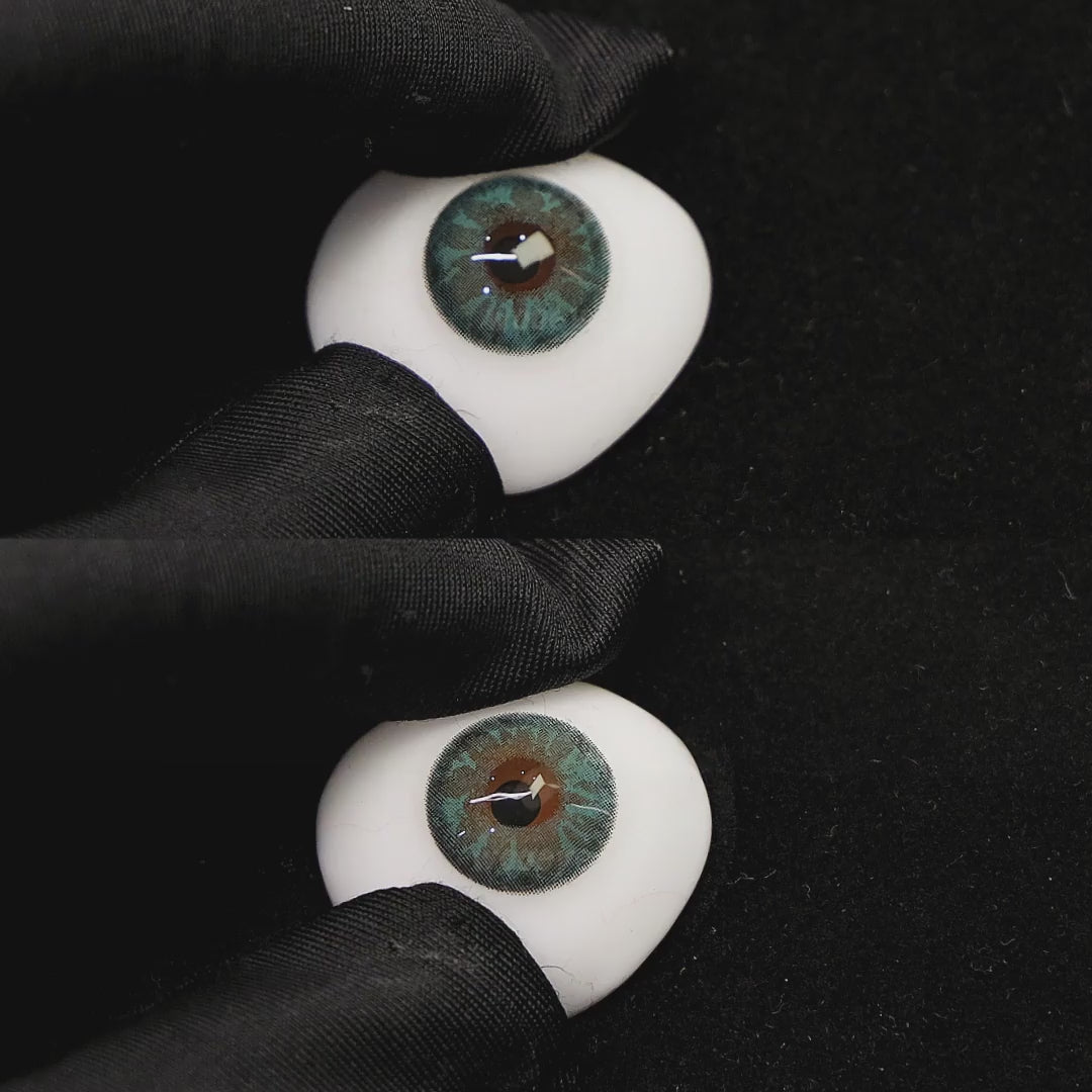 A simulated brown prosthetic eye showing the visual transformation effect of wearing charming green colored contact lenses against a black background.