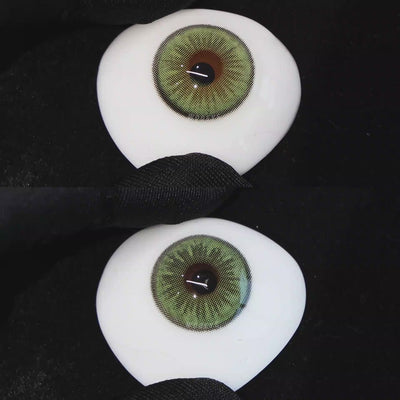 A simulated brown prosthetic eye showing the visual transformation effect of wearing Sugar Green colored contact lenses against a black background.