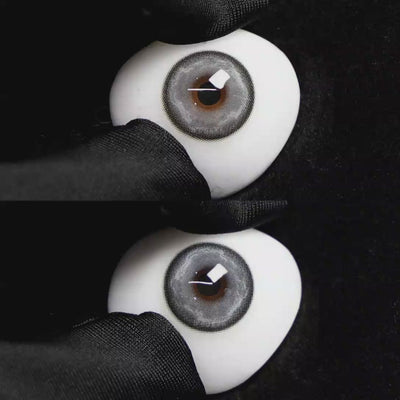 A simulated brown prosthetic eye showing the visual transformation effect of wearing Wooeye Heaven Gray colored contact lenses against a black background.