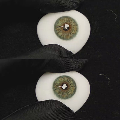 A simulated brown prosthetic eye showing the visual transformation effect of wearing Breeze Hazel Green colored contact lenses against a black background.
