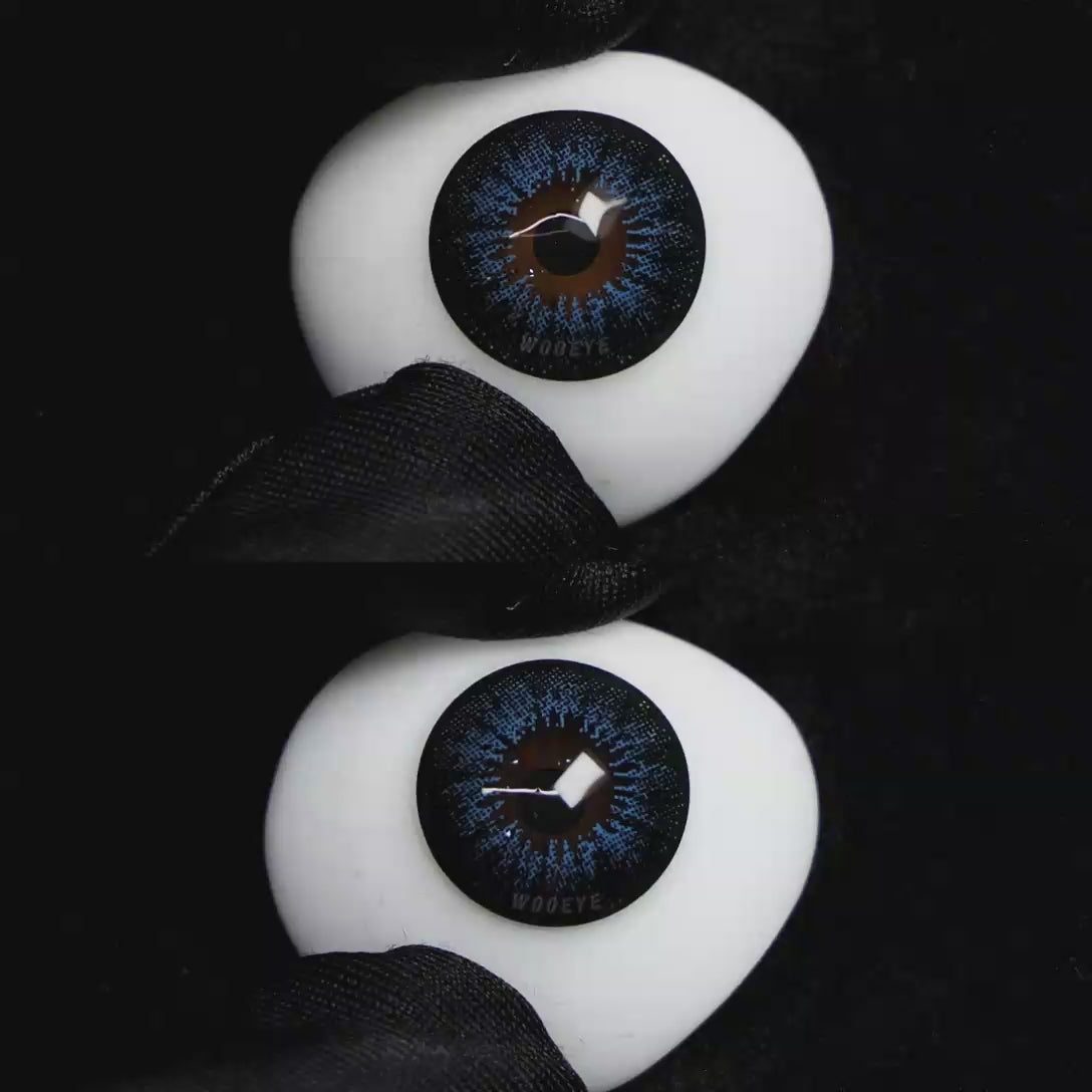 A simulated brown prosthetic eye showing the visual transformation effect of wearing Wooeye Pearl Blue colored contact lenses against a black background.