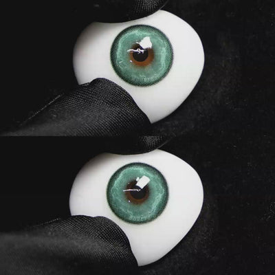 A simulated brown prosthetic eye showing the visual transformation effect of wearing Wooeye Heaven Green colored contact lenses against a black background.