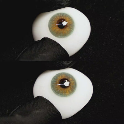 A simulated brown prosthetic eye showing the visual transformation effect of wearing molly green colored contact lenses against a black background.