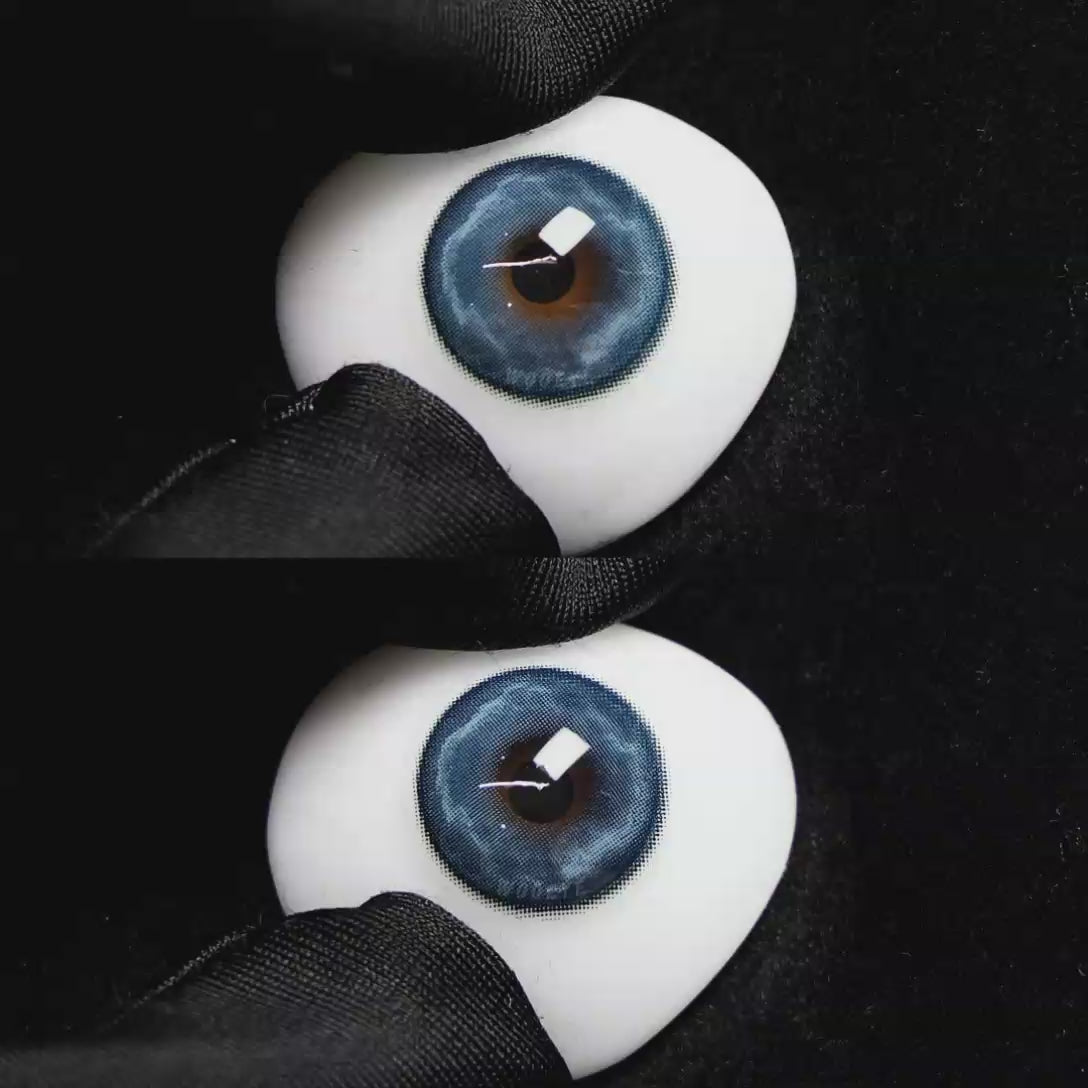 A simulated brown prosthetic eye showing the visual transformation effect of wearing Wooeye Heaven Blue colored contact lenses against a black background.