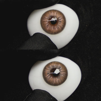 jennie brown contact lenses on a brown simulated eyeball with a black background