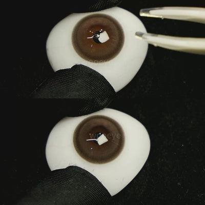 A simulated brown prosthetic eye showing the visual transformation effect of wearing Glossy Brown colored contact lenses against a black background.