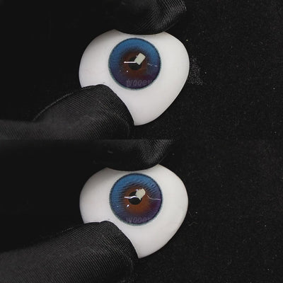 A simulated brown prosthetic eye showing the visual transformation effect of wearing aura blue colored contact lenses against a black background.