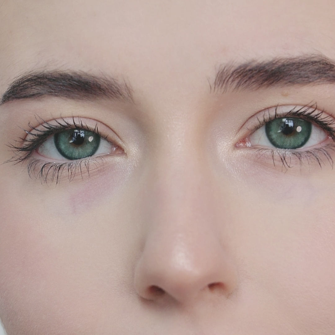 Girl wearing Diamond Green I contact lenses looking forward