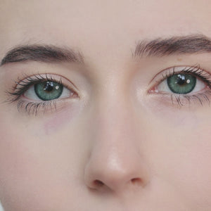 Girl wearing Diamond Green I contact lenses looking forward