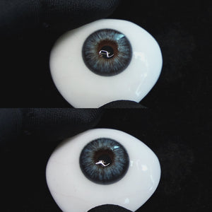 Omg Green contact lenses on a brown simulated eyeball with a black background