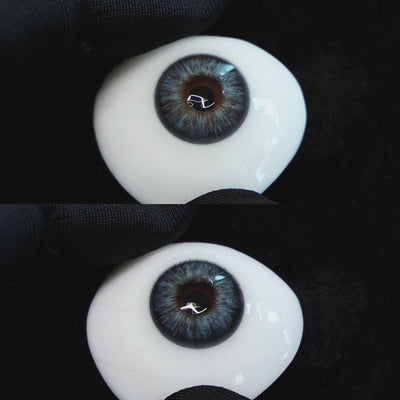 Omg Green contact lenses on a brown simulated eyeball with a black background