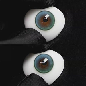 A simulated brown prosthetic eye showing the visual transformation effect of wearing Wooeye Soul Green colored contact lenses against a black background.