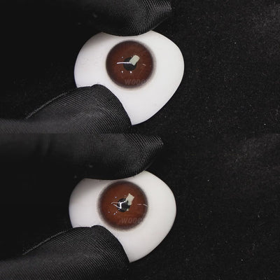 A simulated brown prosthetic eye showing the visual transformation effect of wearing diamond purple colored contact lenses against a black background.