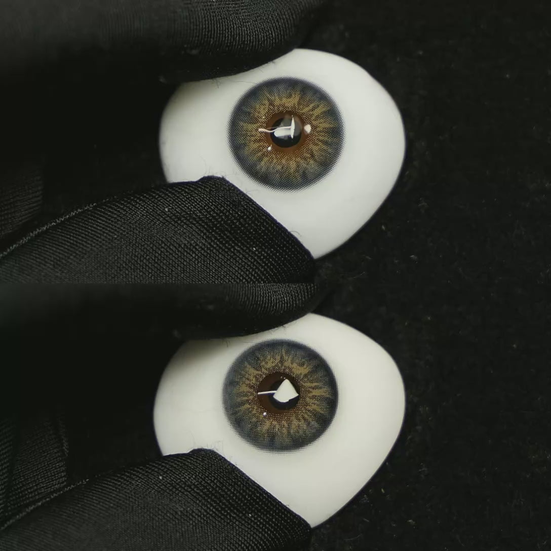 A simulated brown prosthetic eye showing the visual transformation effect of wearing Dancer Deep Blue colored contact lenses against a black background.