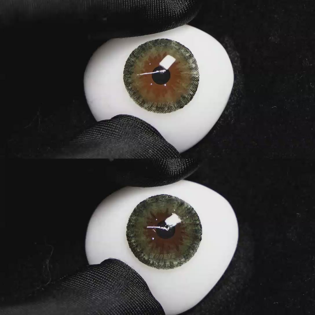 A simulated brown prosthetic eye showing the visual transformation effect of wearing Wooeye Queen Green II colored contact lenses against a black background.