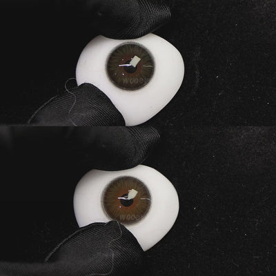 A simulated brown prosthetic eye showing the visual transformation effect of wearing diamond green colored contact lenses against a black background.