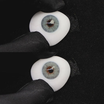 A simulated brown prosthetic eye showing the visual transformation effect of wearing mousse blue colored contact lenses against a black background.