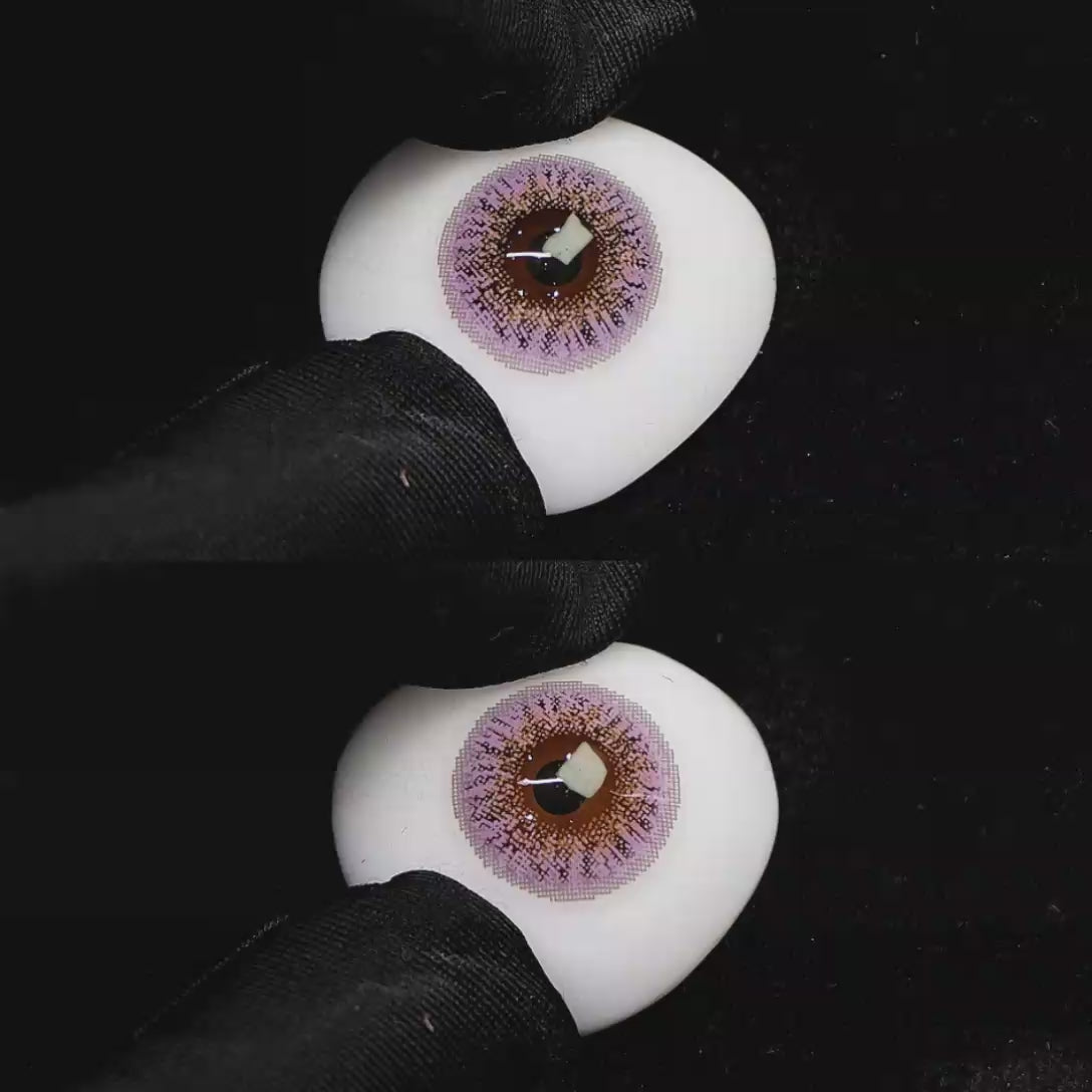 A simulated brown prosthetic eye showing the visual transformation effect of wearing Wooeye Freedom Purple colored contact lenses against a black background.