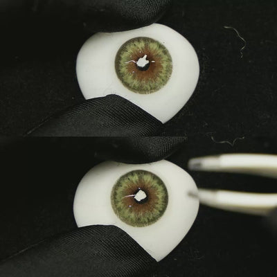 A simulated brown prosthetic eye showing the visual transformation effect of wearing Chamer Green colored contact lenses against a black background.