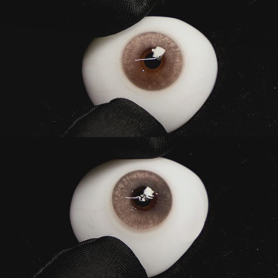 clouds brown contact lenses on a brown simulated eyeball with a black background