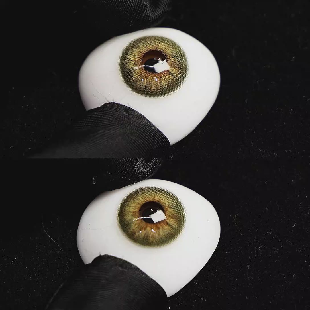 A simulated brown prosthetic eye showing the visual transformation effect of wearing Origin Glow Hazel Brown colored contact lenses against a black background.