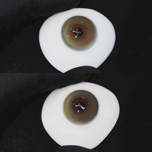 Master Green contact lenses on a brown simulated eyeball with a black background