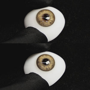 A simulated brown prosthetic eye showing the visual transformation effect of wearing Beverly Brown colored contact lenses against a black background.