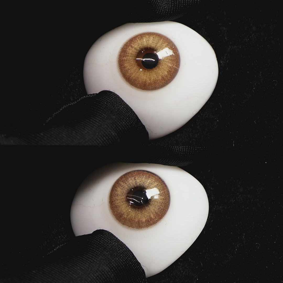Queen Brown III contact lenses on a brown simulated eyeball with a black background