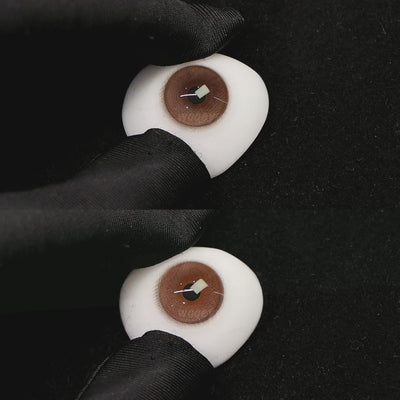 A simulated brown prosthetic eye showing the visual transformation effect of wearing princess coffe brown colored contact lenses against a black background.