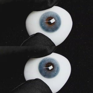 A simulated brown prosthetic eye showing the visual transformation effect of wearing Wooeye Clouds Blue colored contact lenses against a black background.