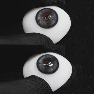 A simulated brown prosthetic eye showing the visual transformation effect of wearing Wooeye Peach Blue colored contact lenses against a black background.