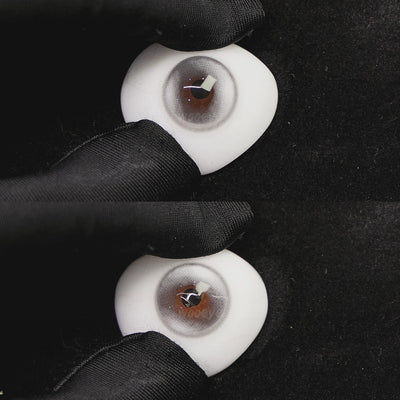 A simulated brown prosthetic eye showing the visual transformation effect of wearing halo pro silver colored contact lenses against a black background.