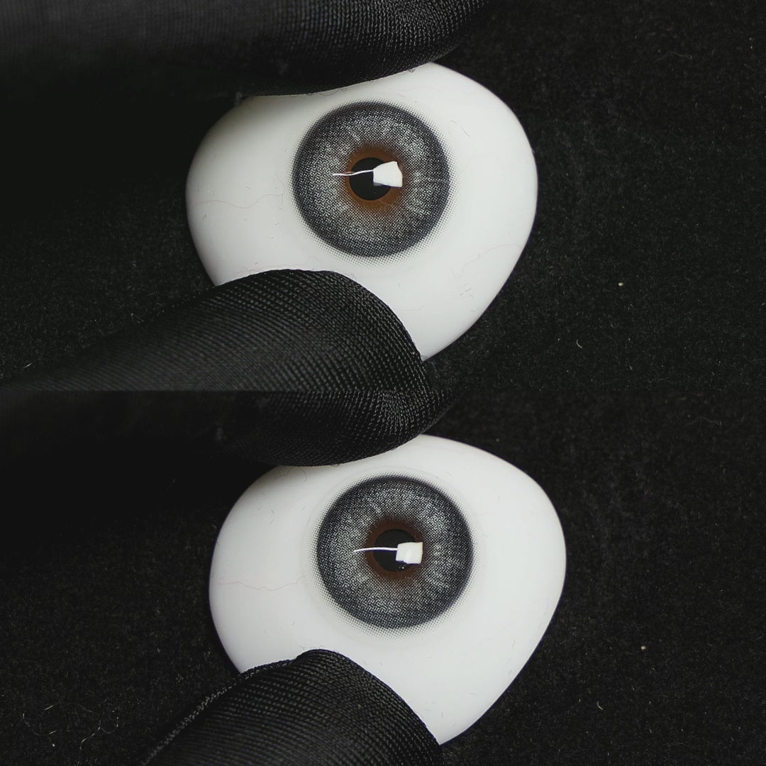 A simulated brown prosthetic eye showing the visual transformation effect of wearing Wooeye Frozen Blue colored contact lenses against a black background.