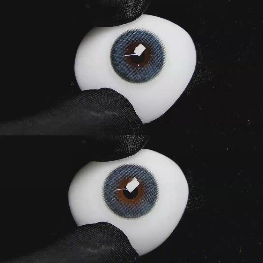 A simulated brown prosthetic eye showing the visual transformation effect of wearing Wooeye Queen Ice Blue colored contact lenses against a black background.