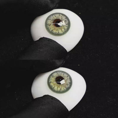 A simulated brown prosthetic eye showing the visual transformation effect of wearing Sequoia Green colored contact lenses against a black background.