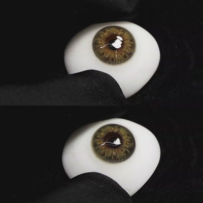 A simulated brown prosthetic eye showing the visual transformation effect of wearing Wooeye Taylor Brown colored contact lenses against a black background.