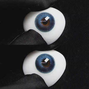 A simulated brown prosthetic eye showing the visual transformation effect of wearing Wooeye Soul Blue colored contact lenses against a black background.