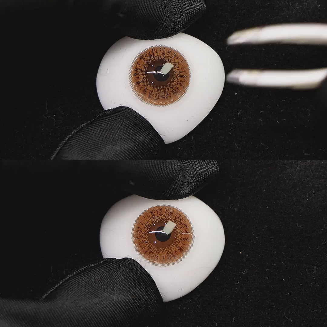 A simulated brown prosthetic eye showing the visual transformation effect of wearing coffee gray colored contact lenses against a black background.