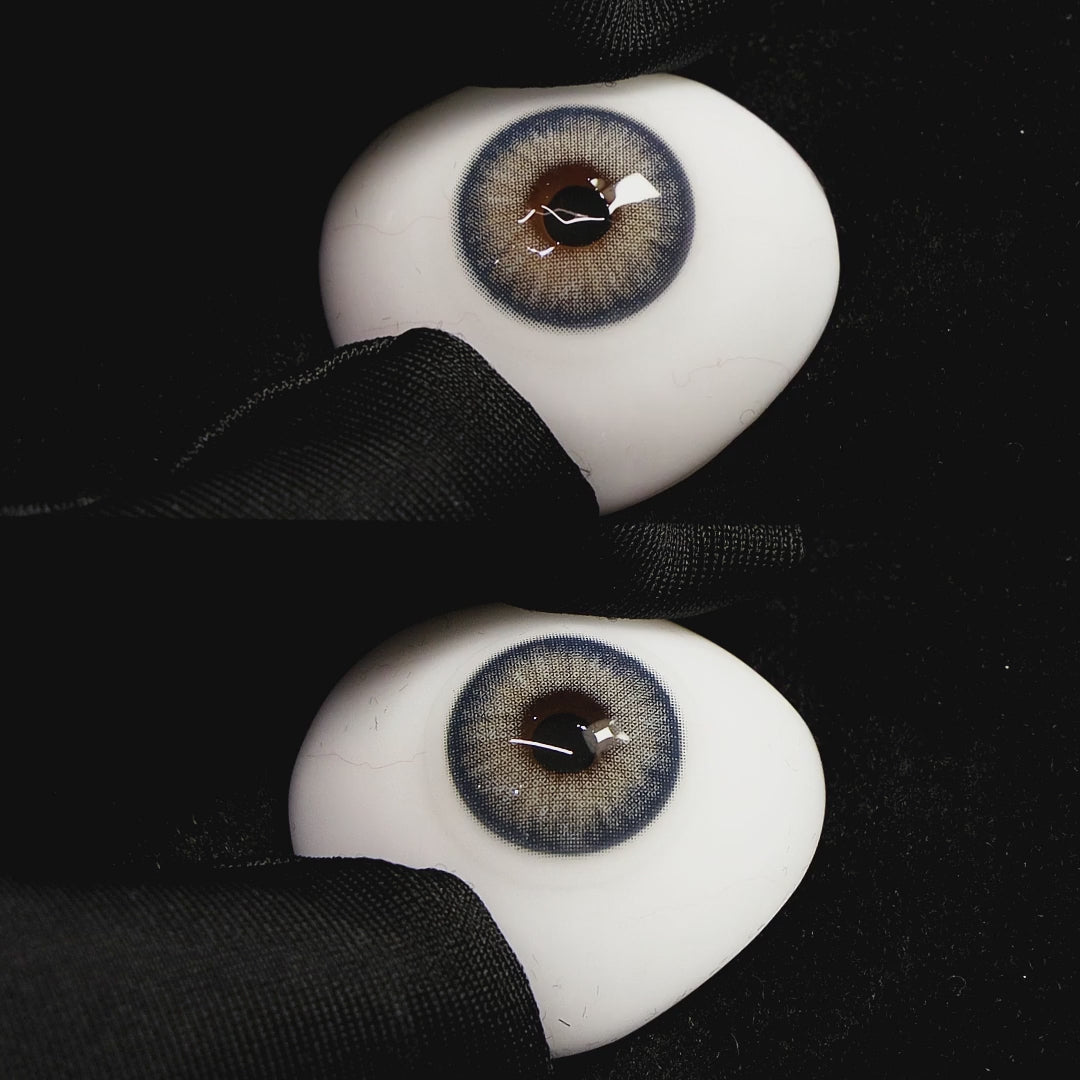 Queen Blue contact lenses on a brown simulated eyeball with a black background