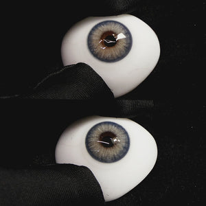 Queen Blue contact lenses on a brown simulated eyeball with a black background
