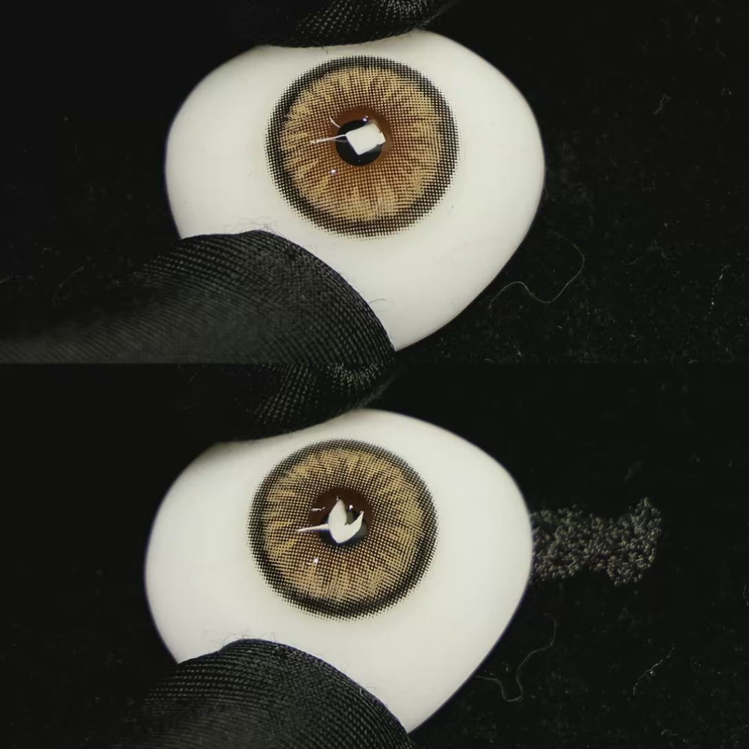 A simulated brown prosthetic eye showing the visual transformation effect of wearing Sugar Brown colored contact lenses against a black background.