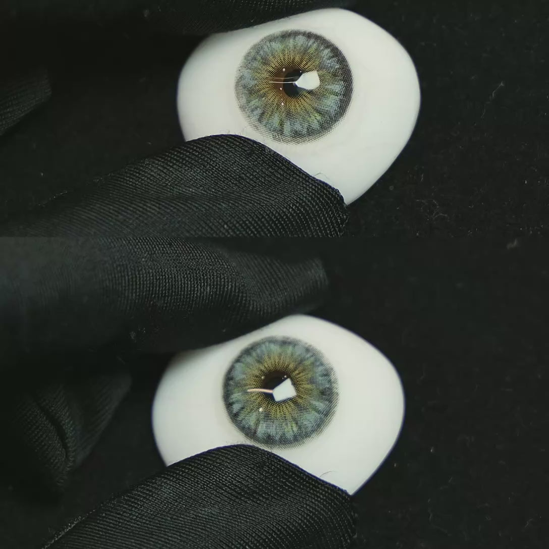 A simulated brown prosthetic eye showing the visual transformation effect of wearing Thorn Blue colored contact lenses against a black background.