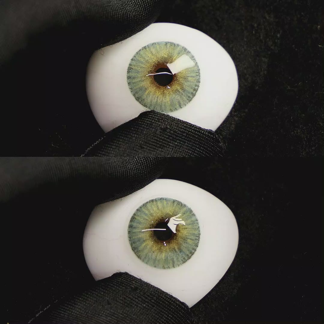 A simulated brown prosthetic eye showing the visual transformation effect of wearing Mist Green colored contact lenses against a black background.