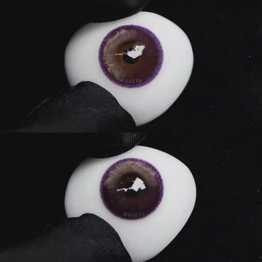 A simulated brown prosthetic eye showing the visual transformation effect of wearing Wooeye Bubbles Purple colored contact lenses against a black background.