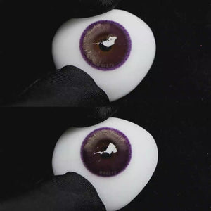 A simulated brown prosthetic eye showing the visual transformation effect of wearing Wooeye Bubbles Purple colored contact lenses against a black background.