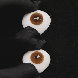 A simulated brown prosthetic eye showing the visual transformation effect of wearing coffee brown colored contact lenses against a black background.